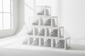 Clear stackable shoe box storage containers neatly stacked on a white background