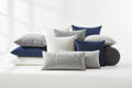 Soft cotton pillows in white, gray, and navy blue